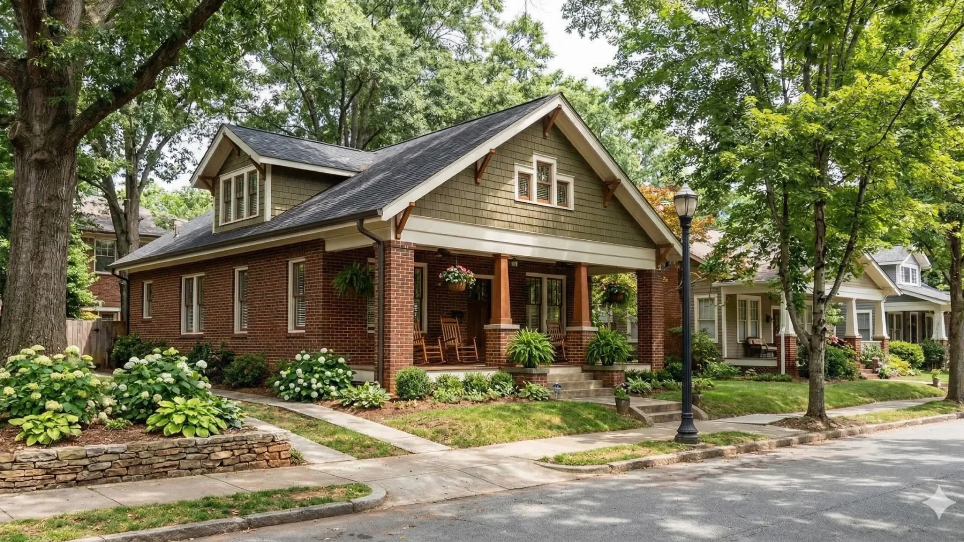 Brick craftsman bungalow with a deep porch on a tree-lined sidewalk street