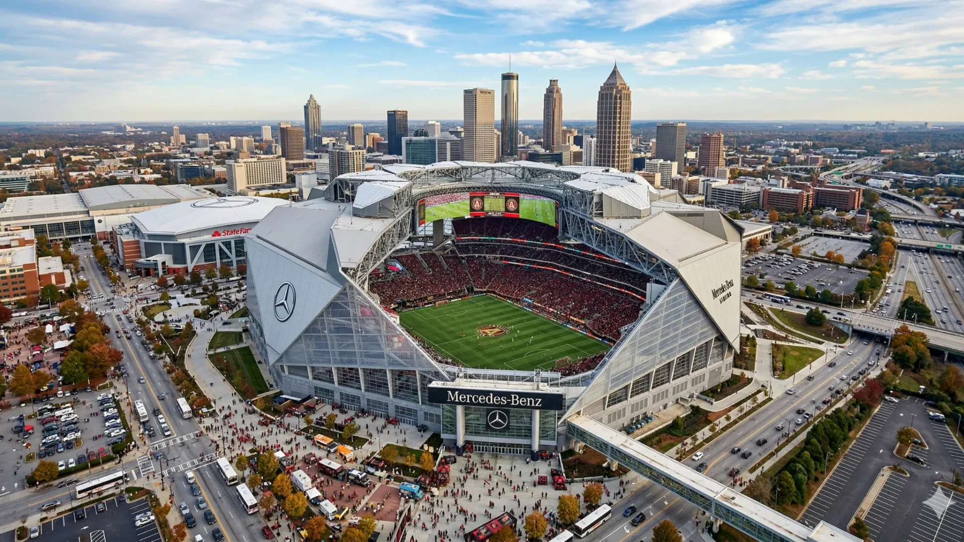 An aerial view of a full stadium with the Atlanta skyline in the distance
