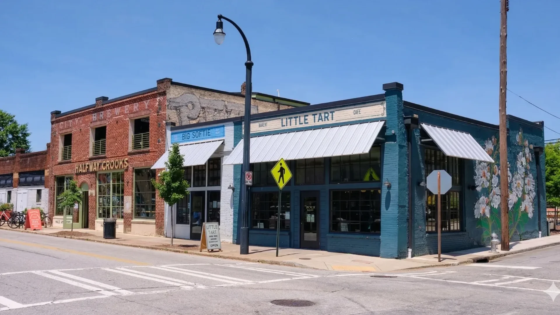 A corner of older brick and painted storefronts at a quiet intersection