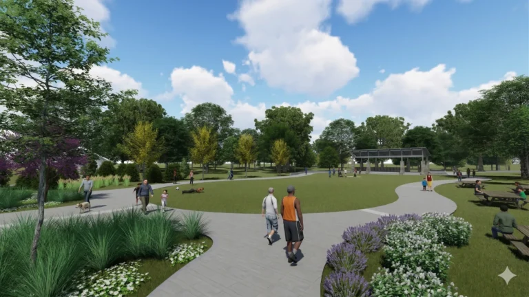 A landscaped park with winding paths and people walking
