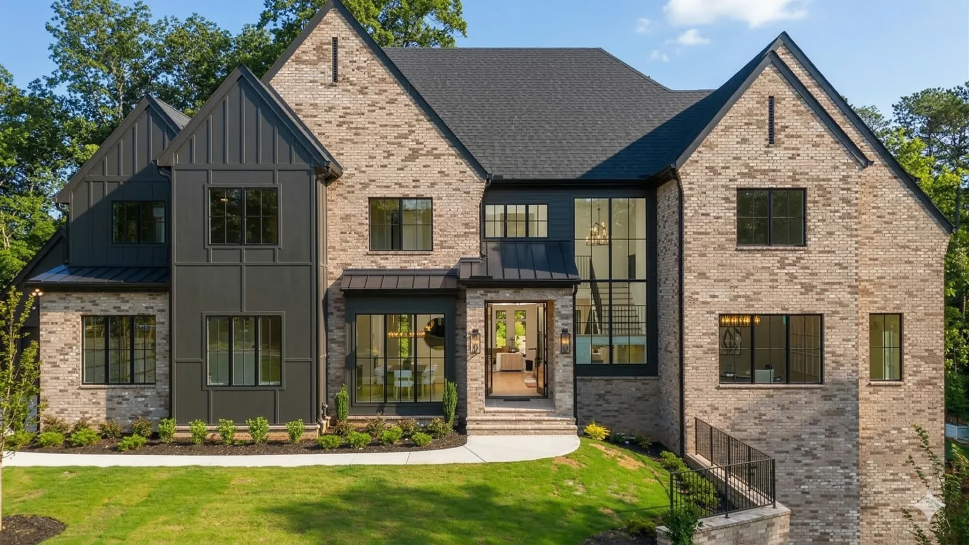 A modern brick and dark clad house with large windows and a corner entry