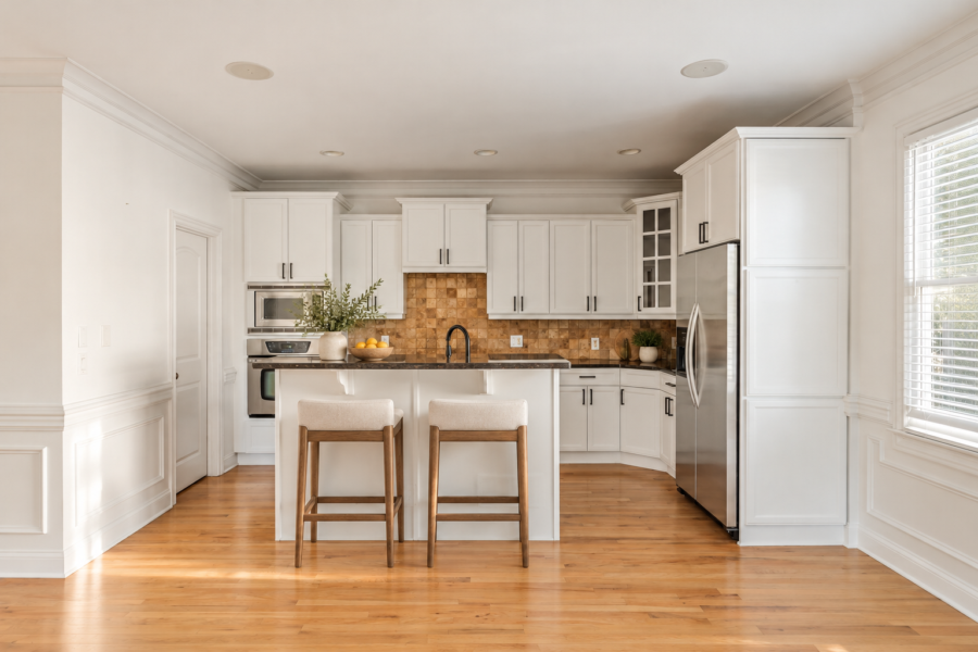 Kitchen with white cabinetry and a center island